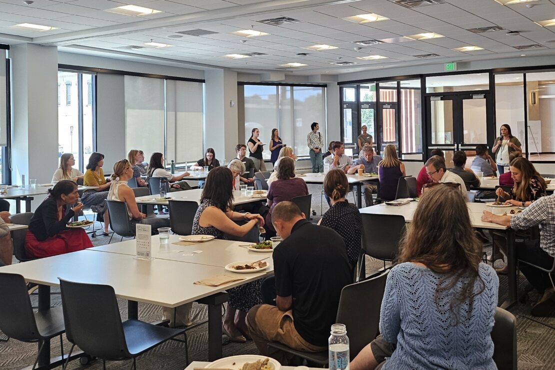 A room full of Sustainable Growth Coalition members listens to Mary LaGarde speak.